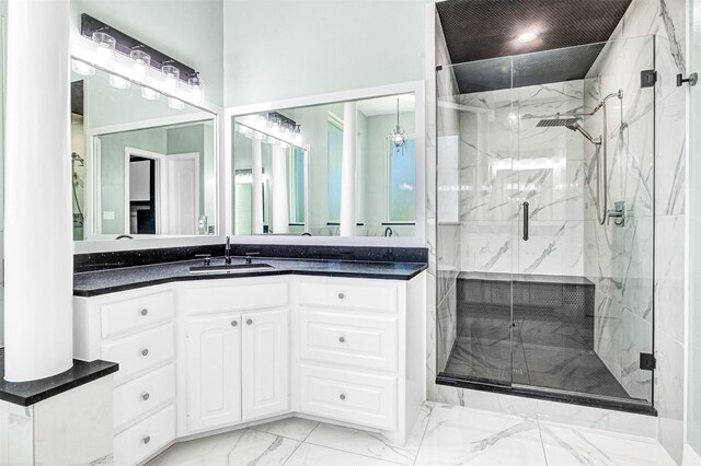 3401 Anthony Cir, Rowlett, TX 75088 - bathroom featuring marble finish floors, vanity, and a marble finish shower