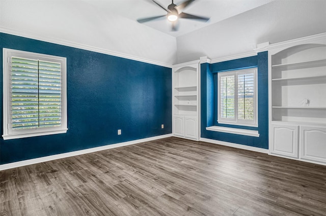 3401 Anthony Cir, Rowlett, TX 75088 - empty room with ceiling fan, wood finished floors, built in shelves, and baseboards