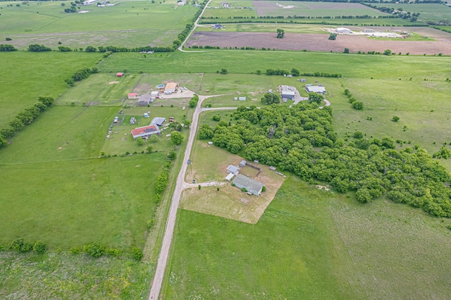 birds eye view of property with a rural view