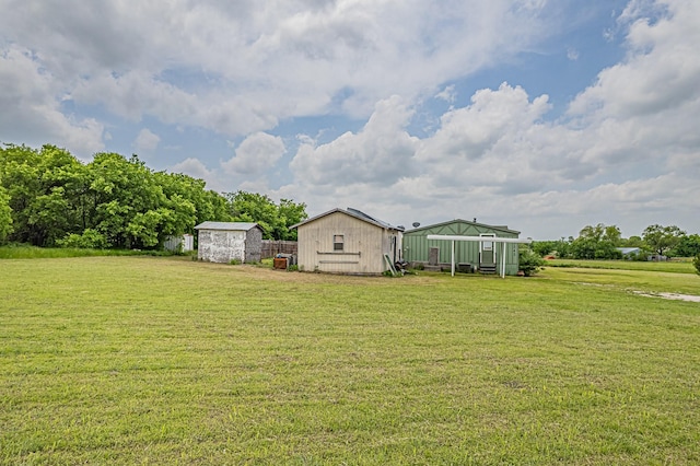 view of yard with a storage shed and an outdoor structure