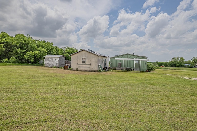 view of yard with an outdoor structure and an outbuilding