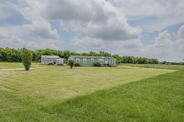view of yard with a rural view