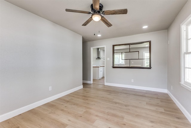 unfurnished room with light wood-style floors, recessed lighting, baseboards, and ceiling fan