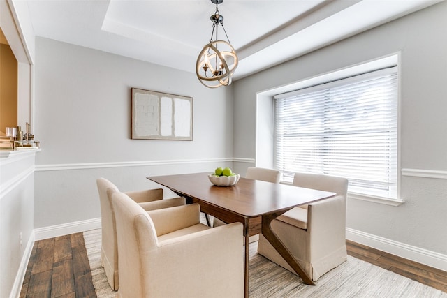 19 Salida Dr, Trophy Club, TX 76262 - dining room featuring a chandelier, wood finished floors, baseboards, and a tray ceiling