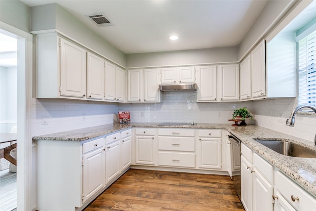 19 Salida Dr, Trophy Club, TX 76262 - kitchen featuring a sink, under cabinet range hood, white cabinets, dark wood-type flooring, and black electric cooktop