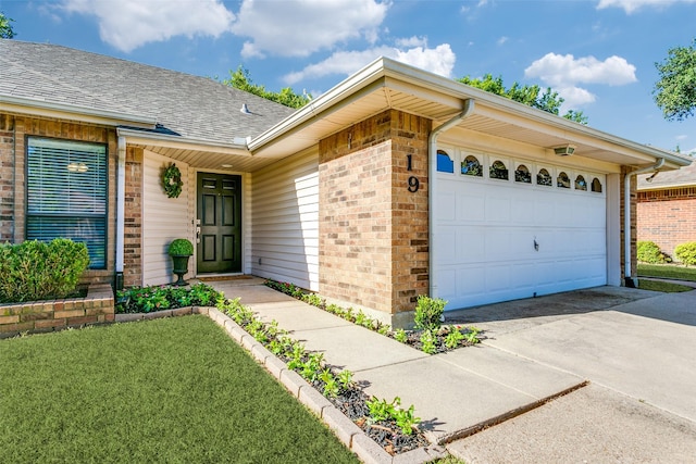 19 Salida Dr, Trophy Club, TX 76262 - view of front of property featuring brick siding, a garage, driveway, and roof with shingles