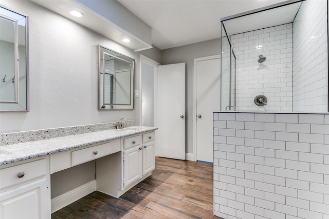 19 Salida Dr, Trophy Club, TX 76262 - bathroom featuring walk in shower, wood finished floors, vanity, baseboards, and recessed lighting