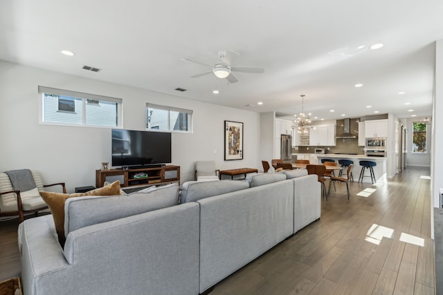5424 Anita St, Dallas, TX 75206 - living area with a ceiling fan, recessed lighting, wood finished floors, and a chandelier