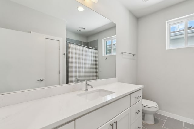 5424 Anita St, Dallas, TX 75206 - bathroom featuring toilet, vanity, tile patterned flooring, a shower with shower curtain, and baseboards