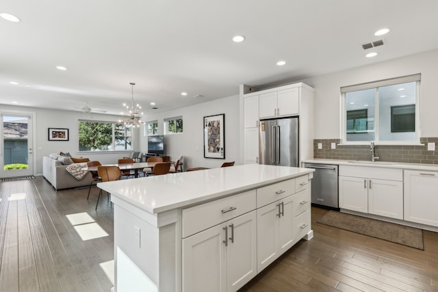 5424 Anita St, Dallas, TX 75206 - kitchen featuring appliances with stainless steel finishes, a chandelier, light countertops, a sink, and recessed lighting