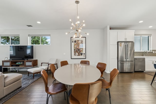 5424 Anita St, Dallas, TX 75206 - dining room with dark wood-style floors, a chandelier, and recessed lighting
