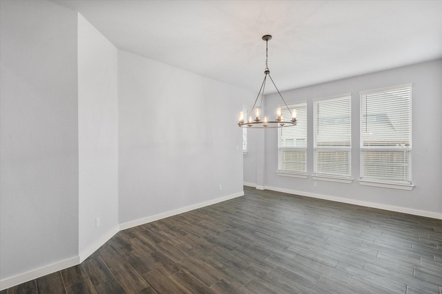 2812 Bluff Creek Dr, Mansfield, TX 76063 - unfurnished dining area with dark wood-style flooring, baseboards, and a chandelier