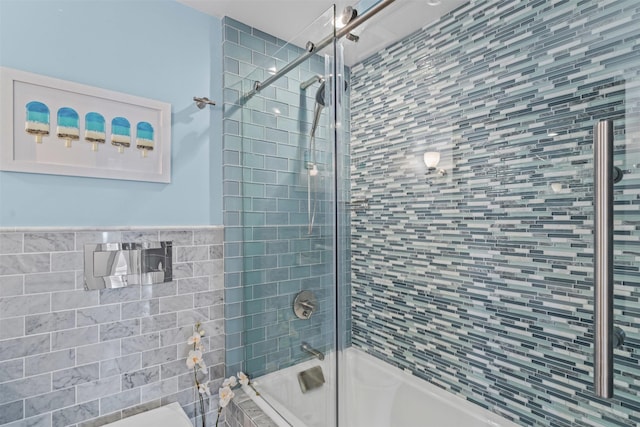 full bath featuring bath / shower combo with glass door