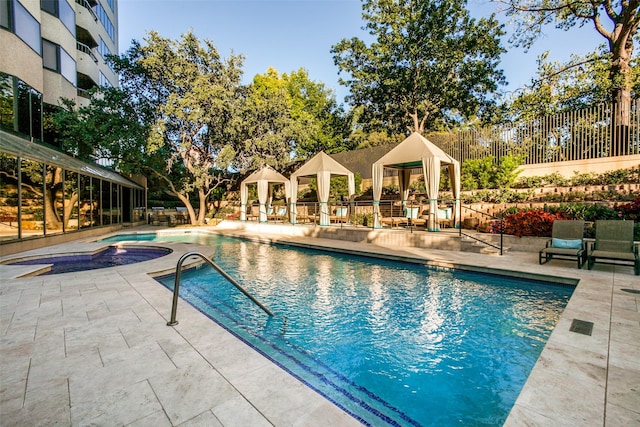 view of pool with fence, a fenced in pool, and a patio