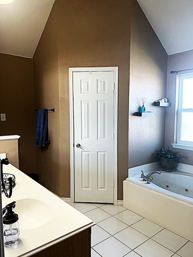1561 Waterford Dr, Lewisville, TX 75077 - full bath with vaulted ceiling, tile patterned floors, a whirlpool tub, and vanity