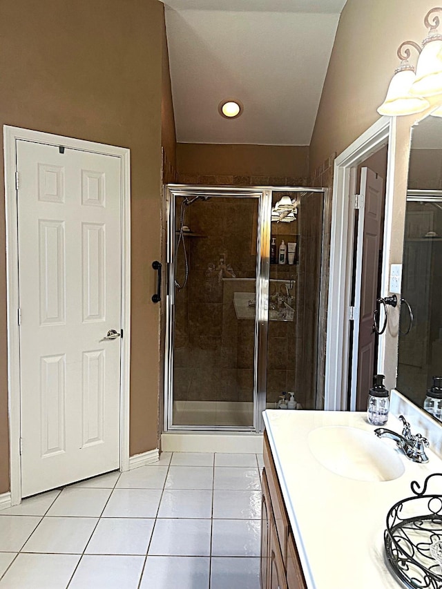 1561 Waterford Dr, Lewisville, TX 75077 - full bathroom featuring tile patterned floors, a shower stall, vanity, vaulted ceiling, and recessed lighting