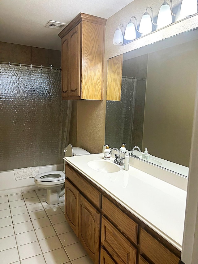 1561 Waterford Dr, Lewisville, TX 75077 - bathroom with toilet, tile patterned flooring, shower / tub combo, vanity, and a textured wall
