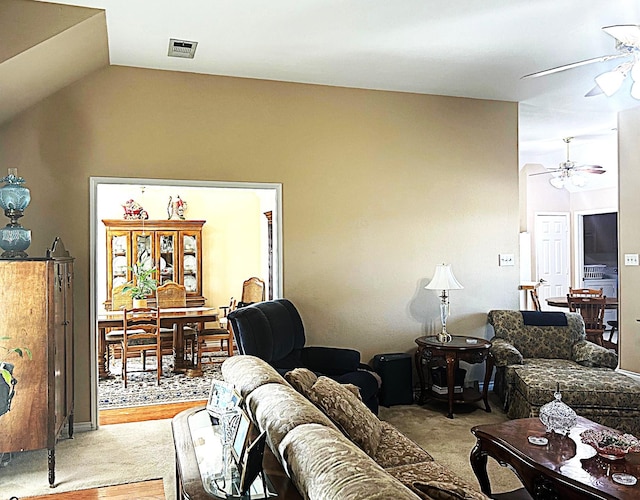 1561 Waterford Dr, Lewisville, TX 75077 - living area with a ceiling fan, vaulted ceiling, and light colored carpet
