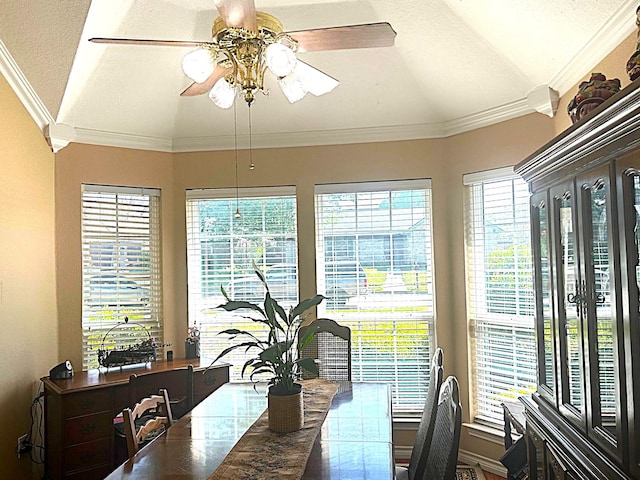 1561 Waterford Dr, Lewisville, TX 75077 - dining room featuring a ceiling fan, lofted ceiling, and crown molding