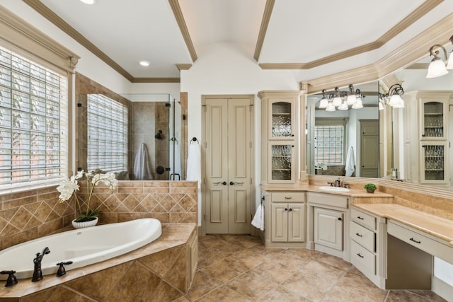 bathroom featuring a garden tub, plenty of natural light, a stall shower, and vanity