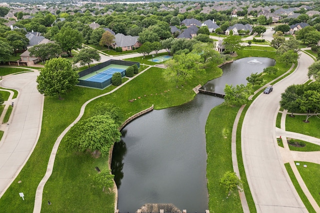 birds eye view of property with a water view and a residential view