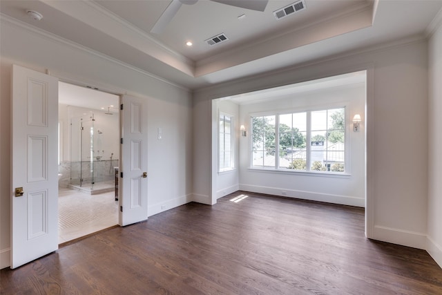 7538 Centenary Ave, Dallas, TX 75225 - spare room featuring a tray ceiling, ornamental molding, a ceiling fan, dark wood-style floors, and baseboards