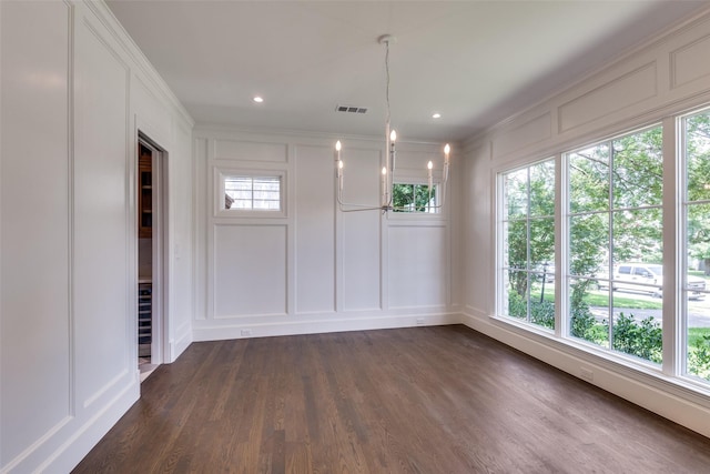 7538 Centenary Ave, Dallas, TX 75225 - unfurnished dining area featuring a decorative wall, ornamental molding, dark wood-type flooring, healthy amount of natural light, and recessed lighting