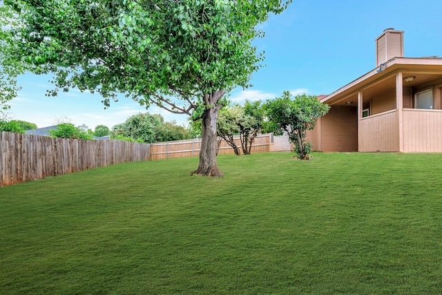 view of yard featuring a fenced backyard