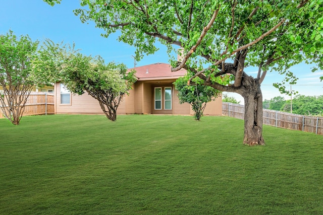 exterior space with a fenced backyard