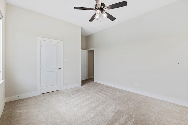 interior space featuring baseboards, carpet flooring, and a ceiling fan