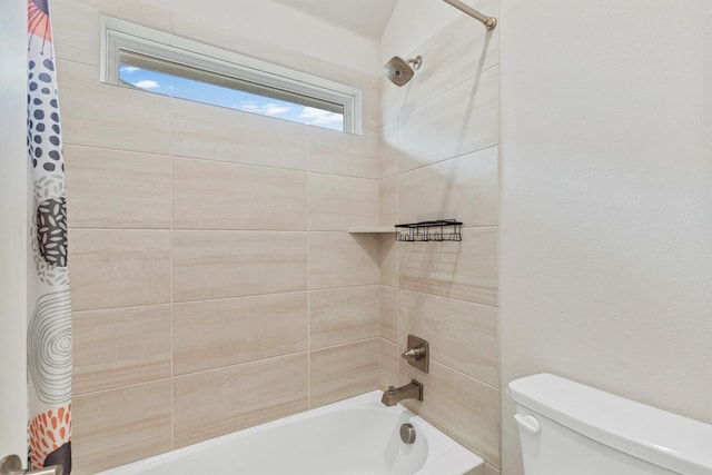 bathroom with shower / bath combo with shower curtain and toilet