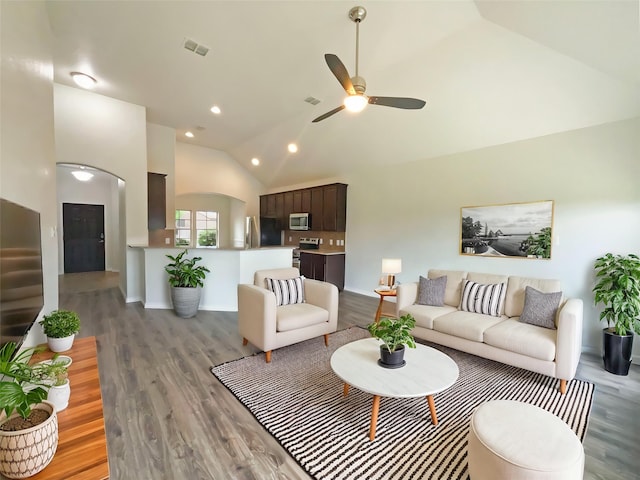 living area with visible vents, ceiling fan, high vaulted ceiling, recessed lighting, and light wood-style flooring