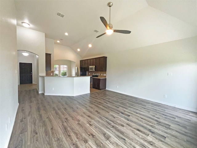 unfurnished living room with a ceiling fan, recessed lighting, wood finished floors, lofted ceiling, and visible vents