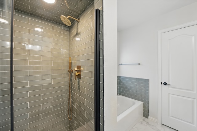 bathroom with a shower stall, a bath, and marble finish floor