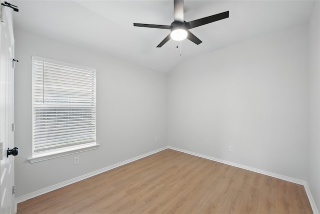 spare room with a ceiling fan, baseboards, and light wood-style floors