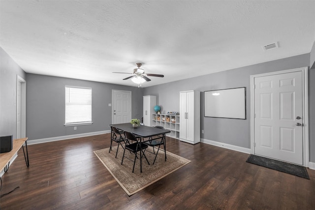 dining space with visible vents, baseboards, ceiling fan, and wood finished floors