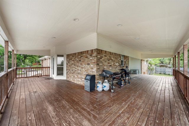 wooden terrace featuring a grill