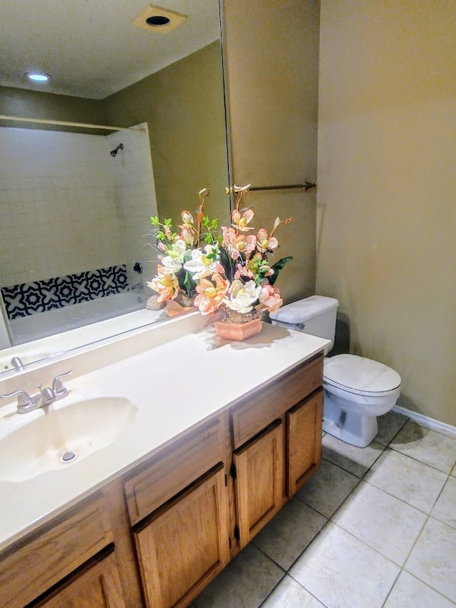 bathroom featuring vanity, walk in shower, tile patterned floors, and toilet