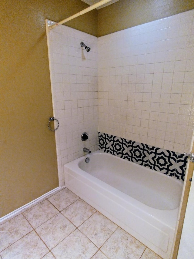 full bath featuring baseboards, tile patterned flooring, and tub / shower combination