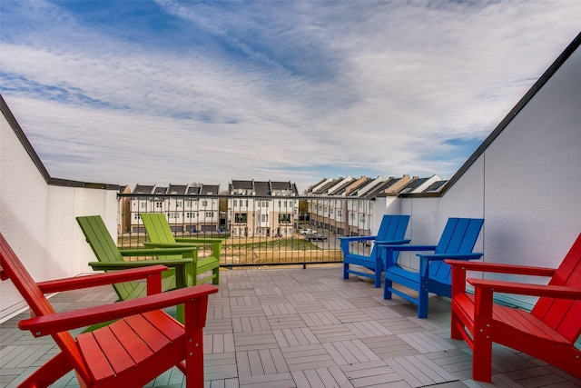 view of patio featuring a balcony