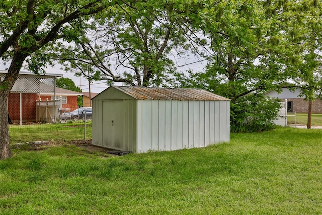 view of shed with fence