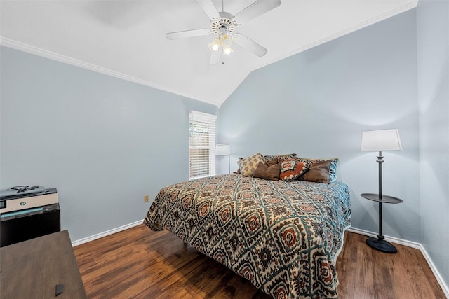 bedroom with a ceiling fan, crown molding, vaulted ceiling, wood finished floors, and baseboards