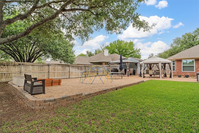 exterior space featuring a playground, a patio, a gazebo, and a fenced backyard