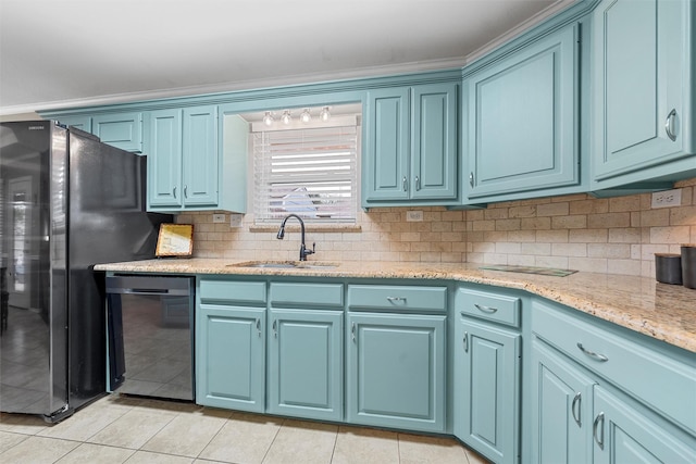 kitchen featuring light tile patterned floors, a sink, dishwashing machine, and blue cabinets
