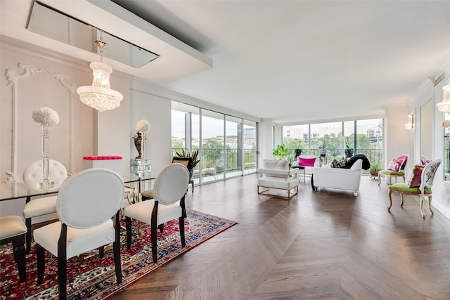 dining room with ornamental molding, a chandelier, and a wall of windows