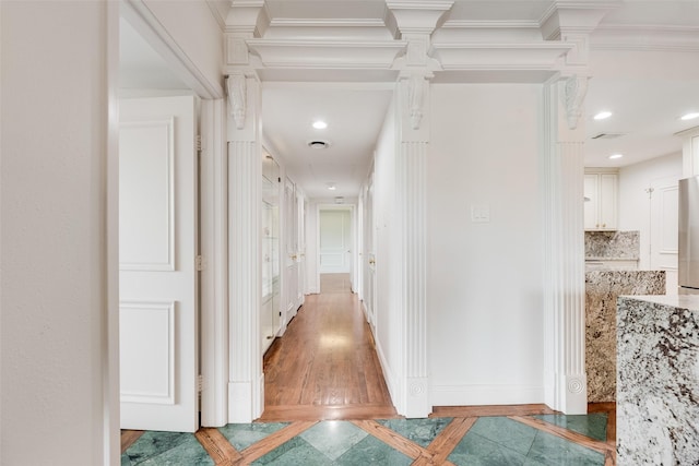 hallway featuring recessed lighting, baseboards, and light wood-type flooring