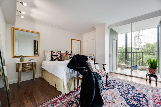 bedroom with crown molding, baseboards, access to outside, and wood finished floors