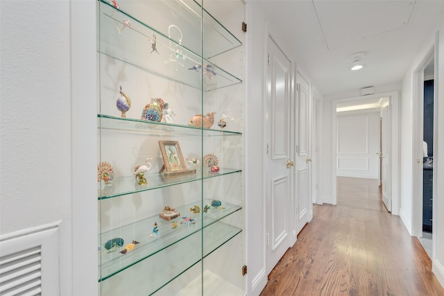 hallway featuring wood finished floors