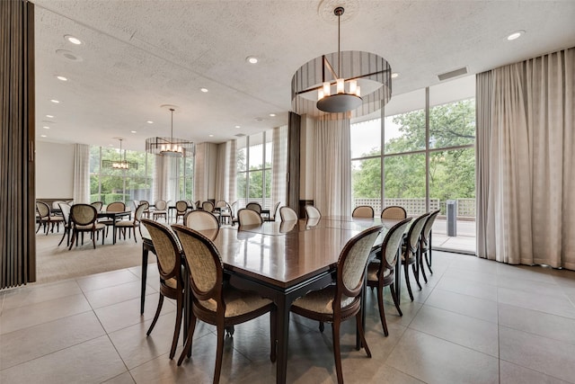 dining space featuring light tile patterned floors, recessed lighting, a textured ceiling, and visible vents