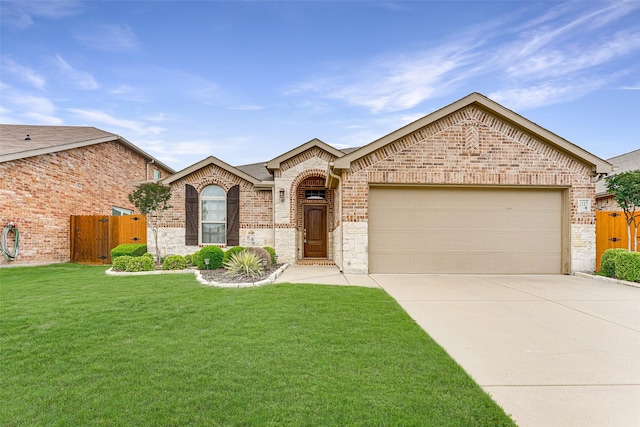 view of front facade with fence, a front yard, brick siding, concrete driveway, and an attached garage